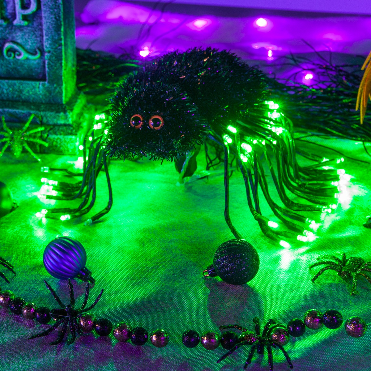 DIY Halloween Decoration - Cute little spider made using starburst lighted branches!