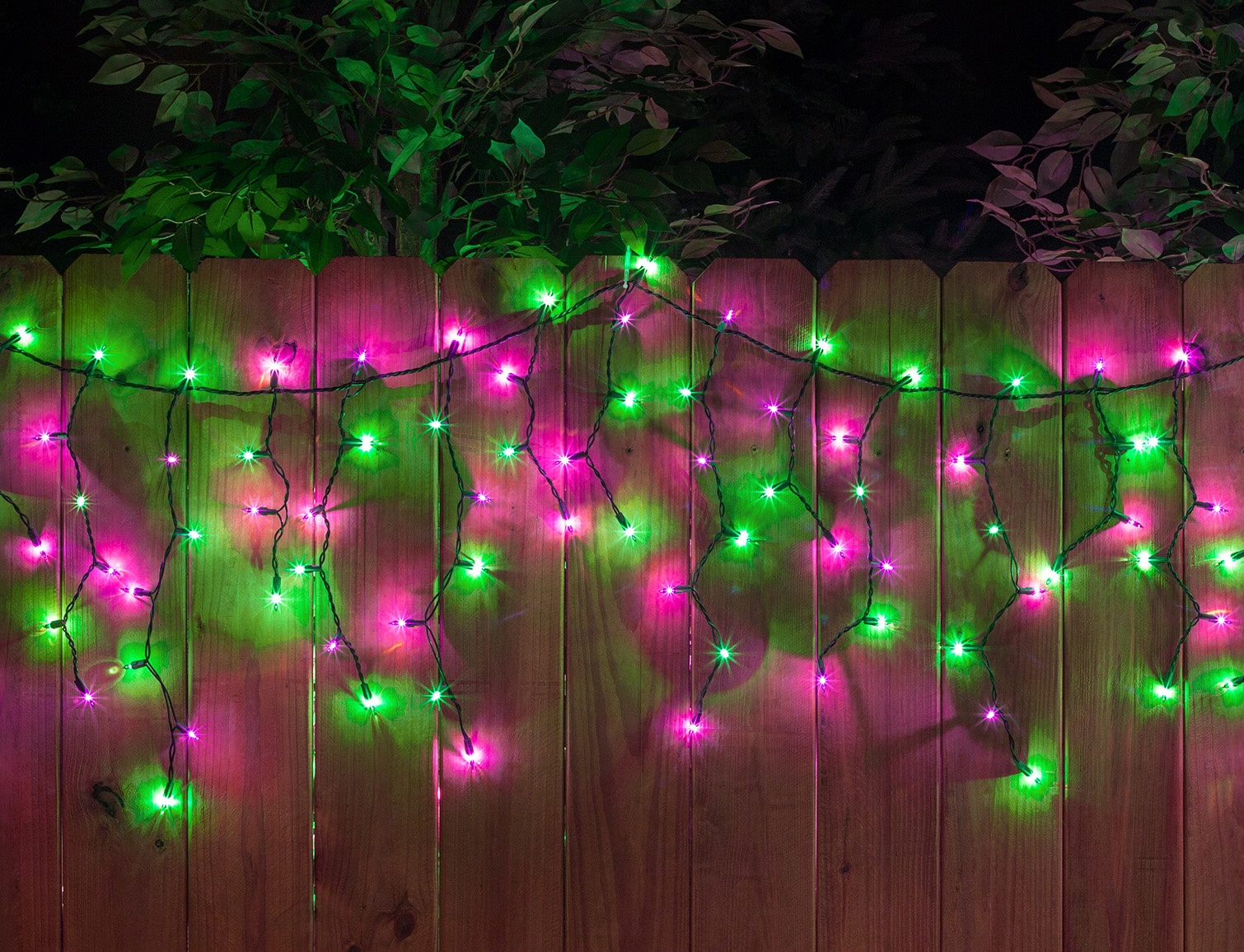 Halloween Icicle Lights Hanging Along a Fence
