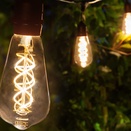 ST64 Suspended FlexFilament TM 5W LED Edison Bulb Patio Lights, Commercial Black Wire